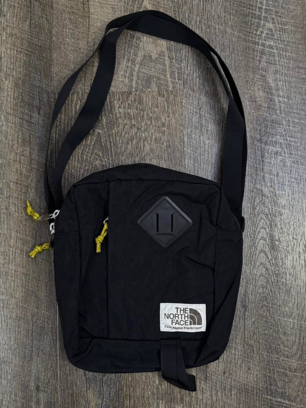 The North Face Black Messenger Bag with Yellow Accents